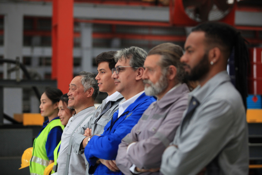 Team of engineers and workers in a factory