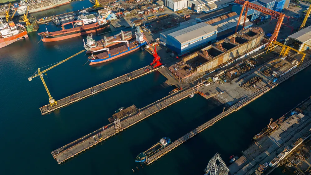 Aerial view of a shipyard with docked vessels